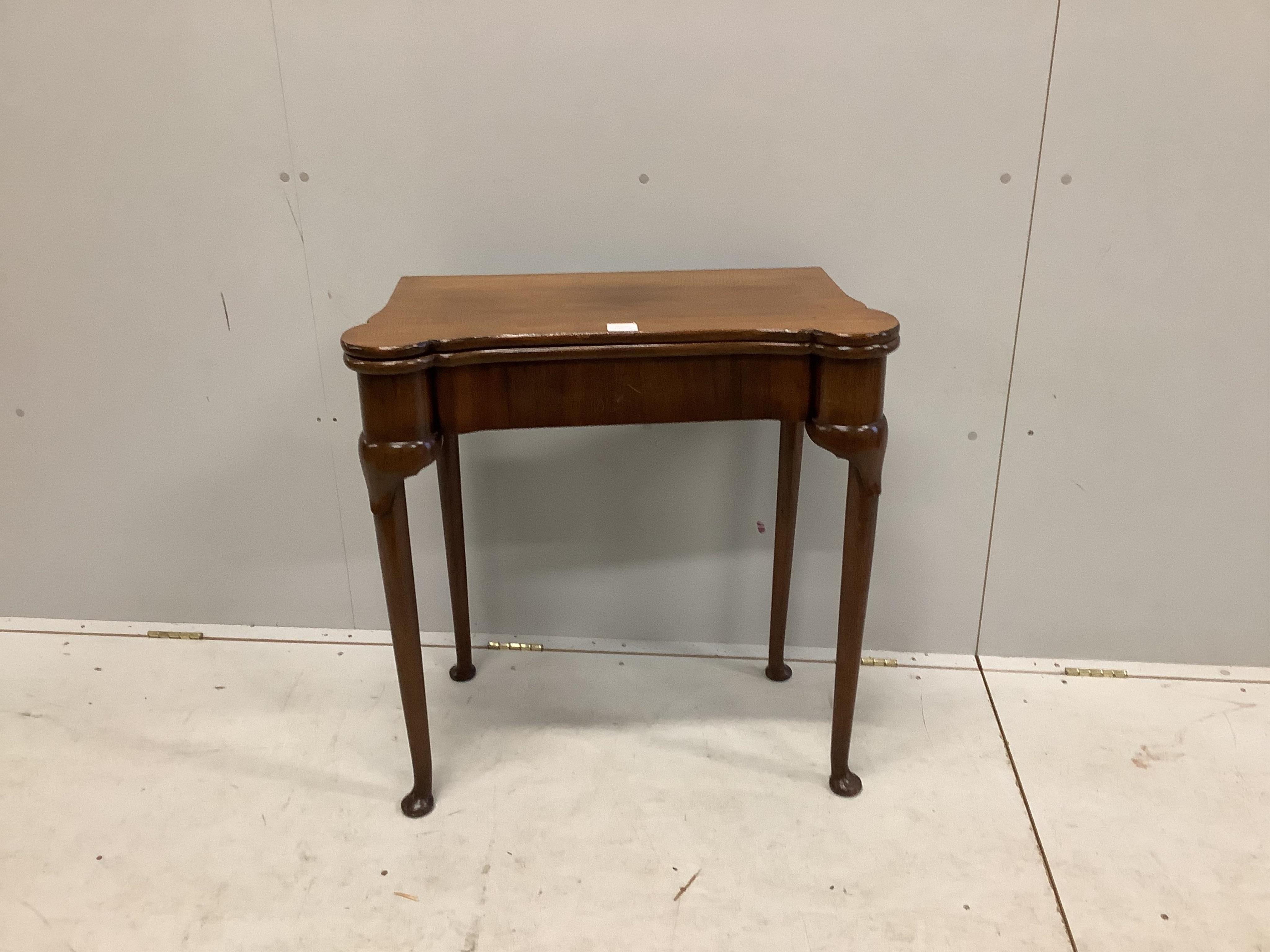 A George II style mahogany folding card table, width 75cm, depth 38cm, height 76cm. Condition - fair to good